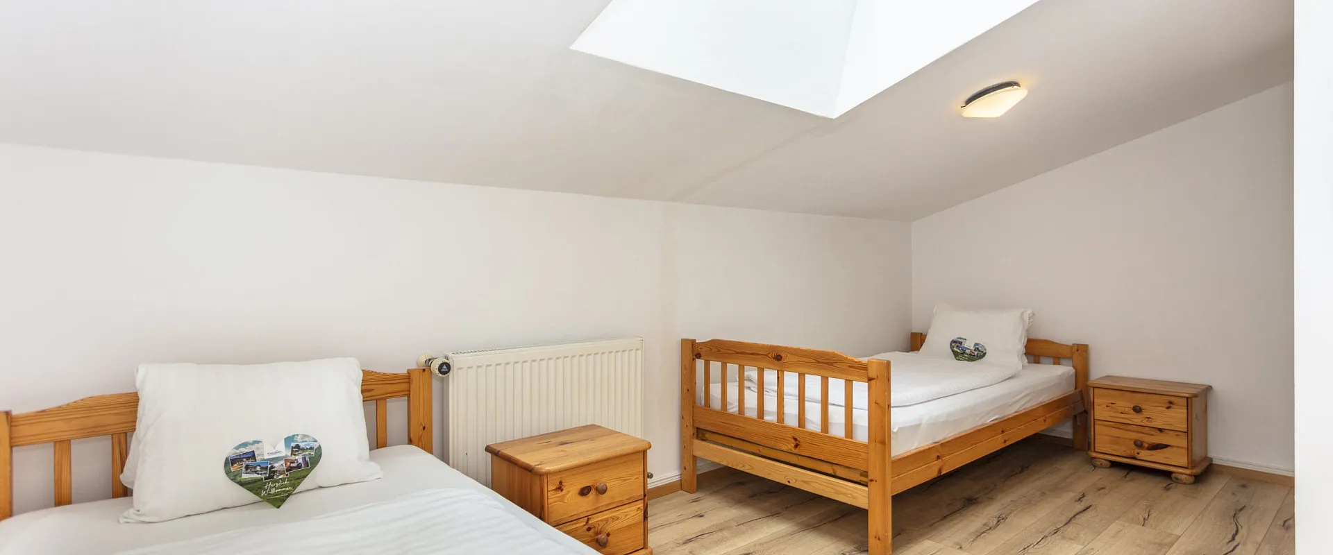 Cosy attic room with two beds