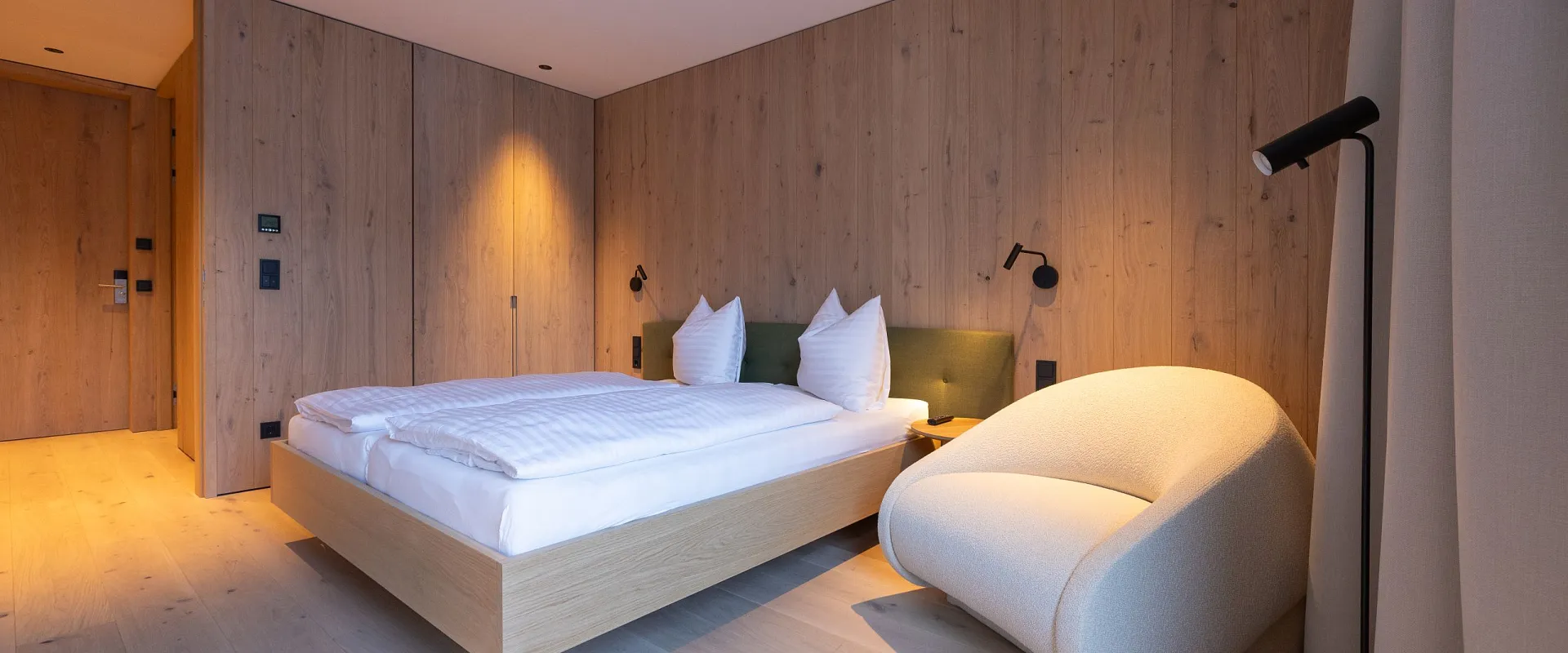 Modern bedroom with wooden floor